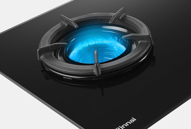 Black glass gas stove with two blue-flame burners and two central control knobs (Rinnai branding on lower-left).