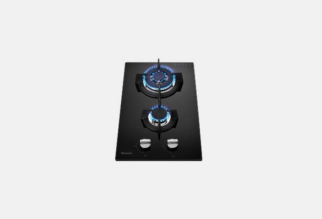 Black glass gas cooktop with two lit burners and two control knobs at the bottom.