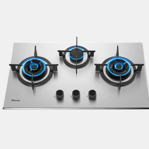 Stainless steel three-burner gas cooktop with blue-flame burners and three control knobs on the front.