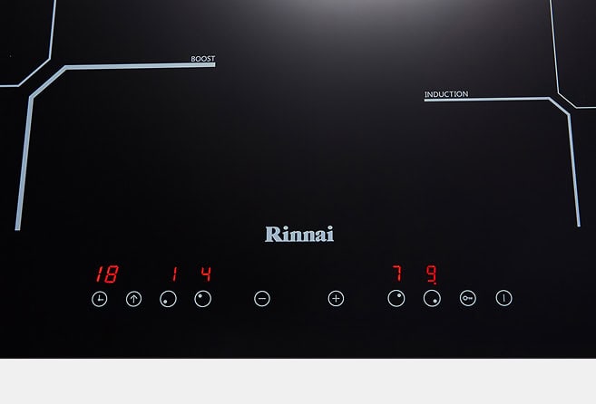 Rinnai induction cooktop control panel on a black surface, with red numeric displays '18 14' on the left and '7 9' on the right, touch buttons below, and BOOST/INDUCTION labels.