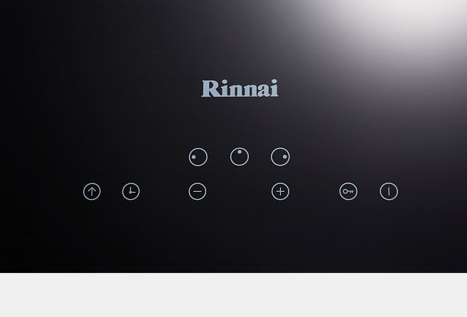 Rinnai control panel with circular touch buttons on a dark surface.