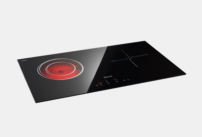 Two-burner induction cooktop with a red glowing circular heating zone on the left and touch controls on the right side.