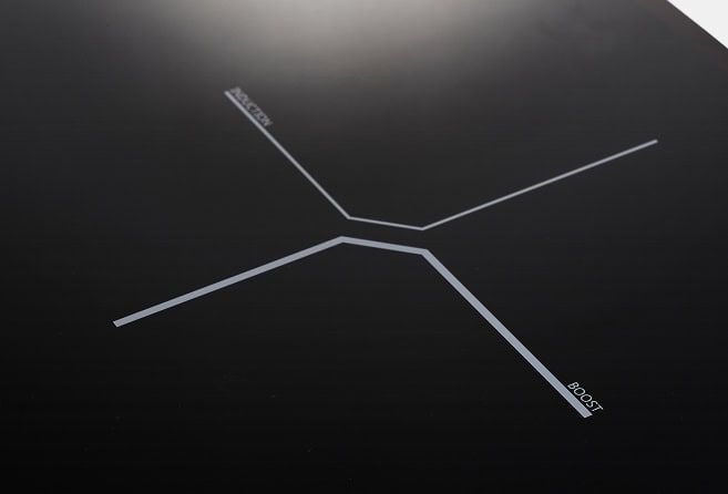 Abstract branching diagram: three white angular lines meet at a central node on a dark background, forming a Y-shaped junction. One branch has a small label that appears to read 'BOOST' (text may be partially obscured).