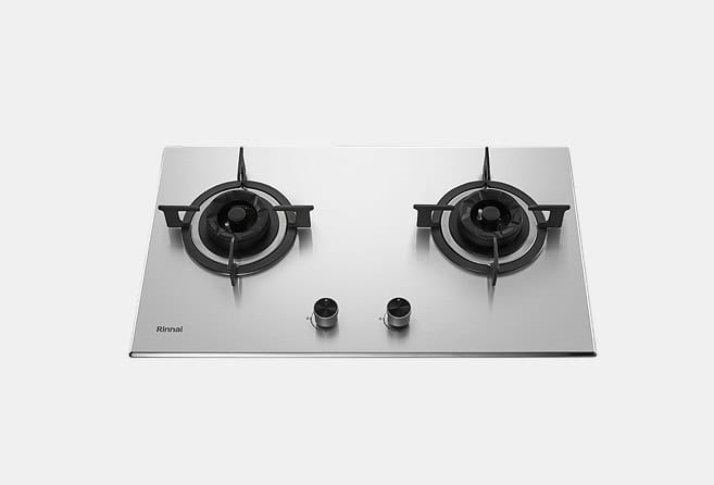 Stainless steel two-burner gas cooktop with black cast-iron grates and two control knobs in the center left side