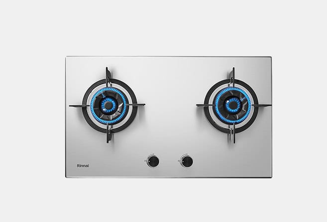 Stainless steel two-burner gas cooktop with blue flames and round grates