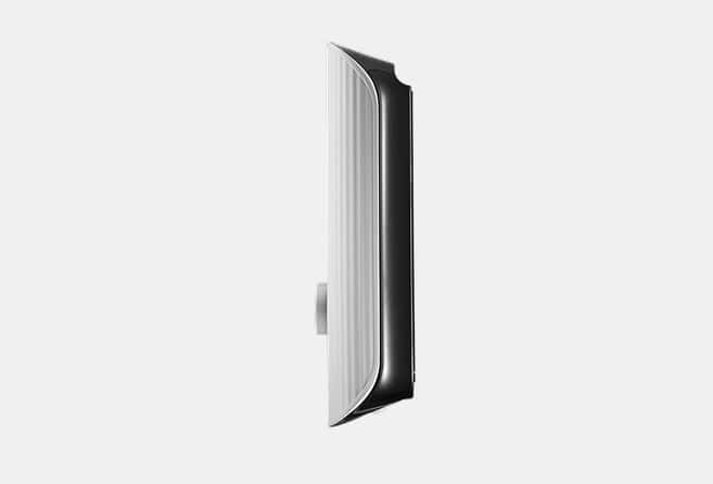 Side view of a modern white wall switch with a small toggle protruding from the side.