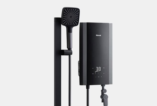 Wall-mounted Rinnai tankless water heater with a digital display showing 38, connected to a handheld shower head on a vertical rail.