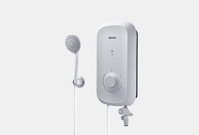 Rinnai wall-mounted tankless water heater with a circular control dial and a connected handheld shower head on a hose.