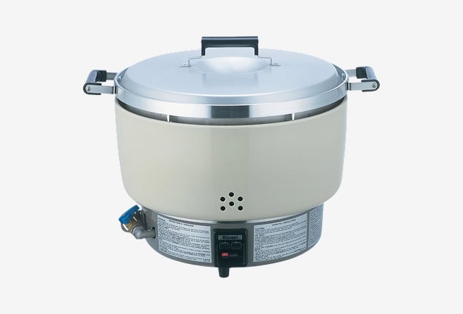 Commercial electric rice steamer with metal lid, side handles, and control panel at the base.