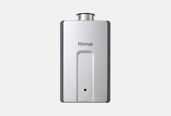 White wall-mounted Rinnai tankless water heater with brand logo on a light background.