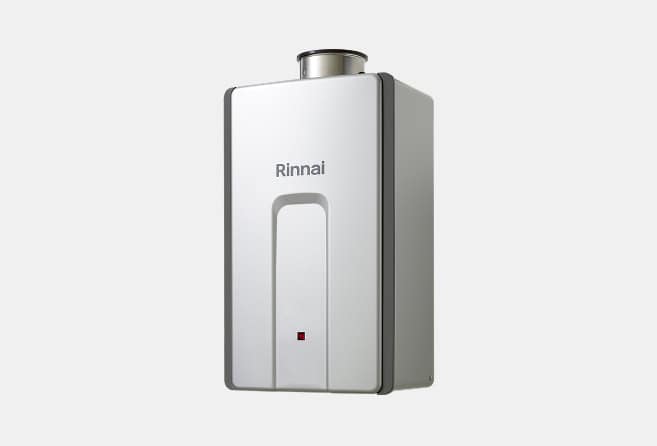 White wall-mounted Rinnai tankless water heater with brand logo on a light background.