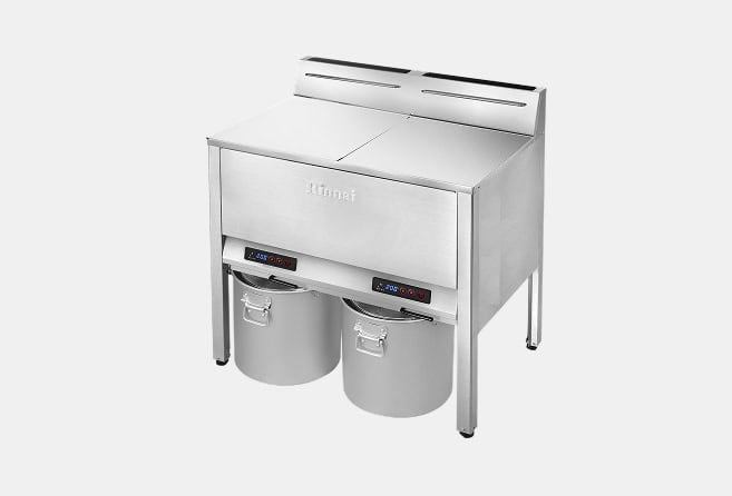Commercial stainless steel double deep fryer with two baskets, digital controls, and two oil reservoirs