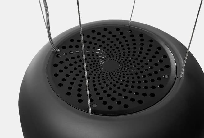 Black spherical pendant speaker with a perforated circular grille and thin metal suspension cables.