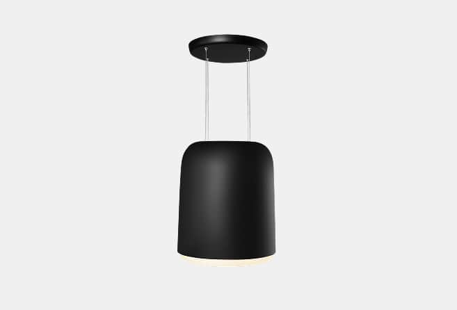 Black cylindrical pendant lamp suspended from ceiling by two cords with a subtle warm glow at the bottom edge
