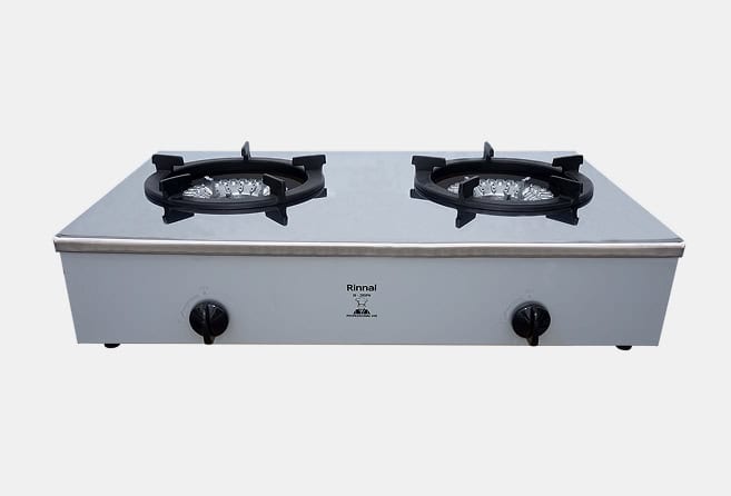 Stainless steel double-burner gas stove with two control knobs on the front and black burner grates.