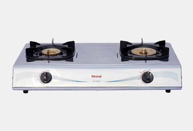 Two-burner portable gas stove with black grate tops and silver body, front control knobs on a white background.