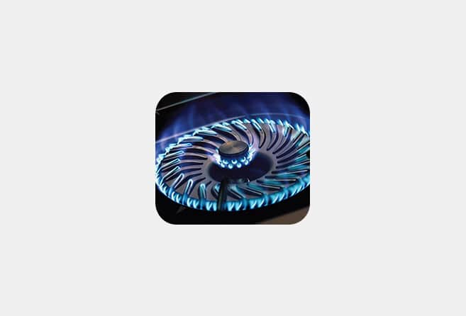 Two-burner portable gas stove with a stainless steel top and black front panel.
