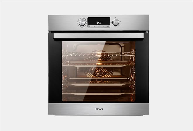 Stainless steel oven with glass door, interior light on and multiple rack levels visible