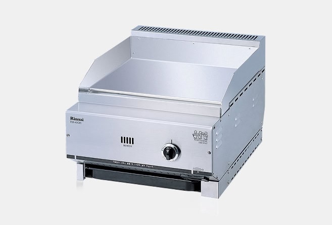 Stainless steel gas grill with a wide front-facing control knob and vented hood.