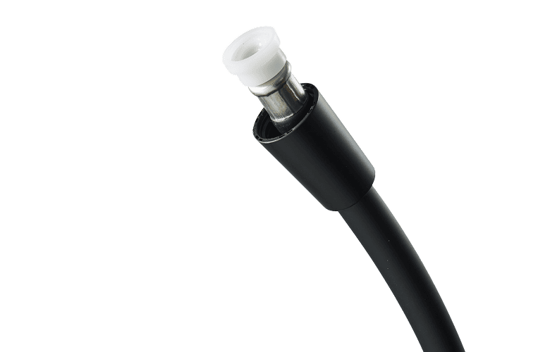 Close-up of a black DC power connector on a cable with a white inner ring, set against a black background.