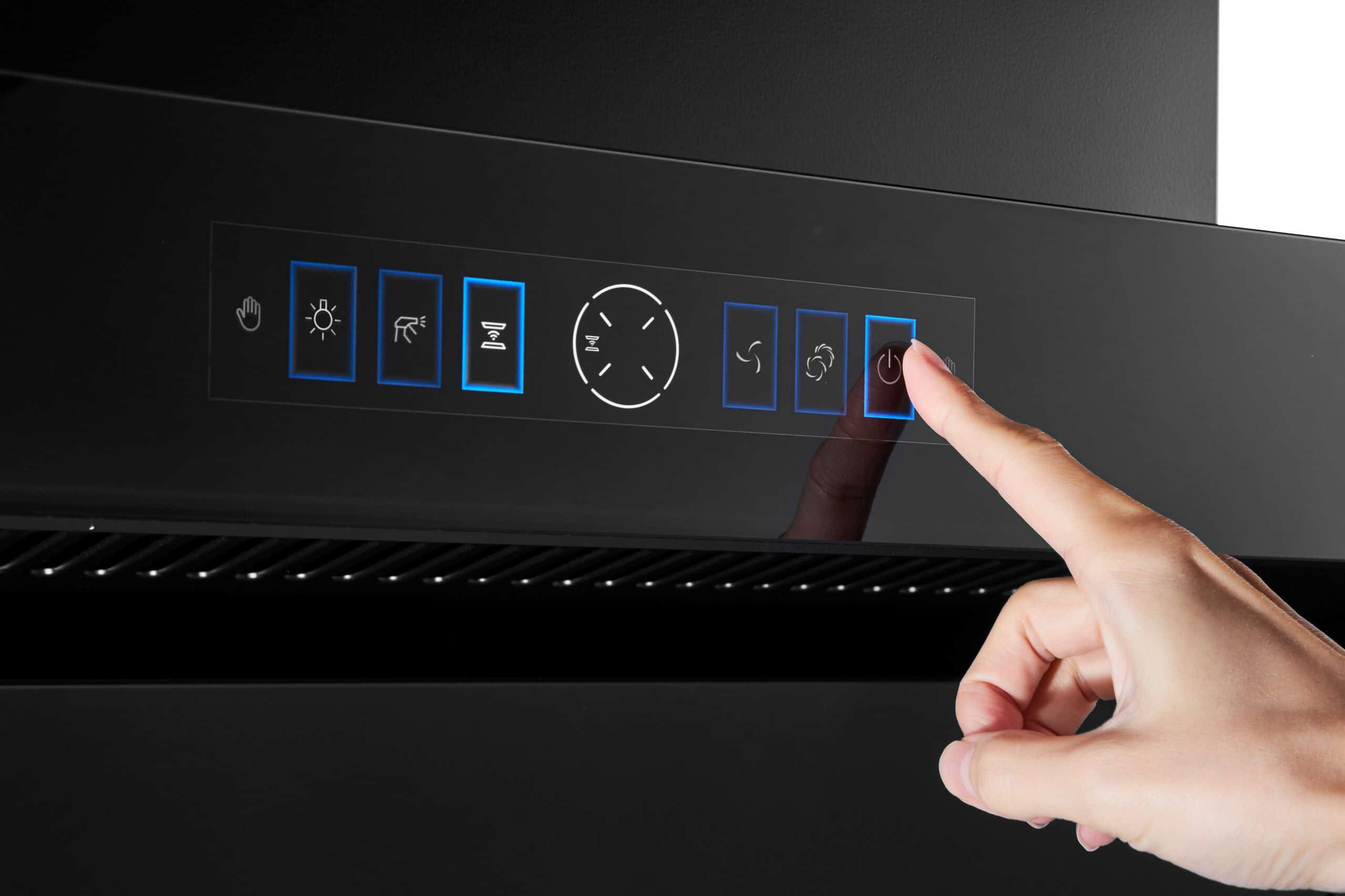 Finger pressing a blue-highlighted button on a touch-control panel of a black appliance, with other blue-outlined icons for settings nearby (hood/lighting/fan).