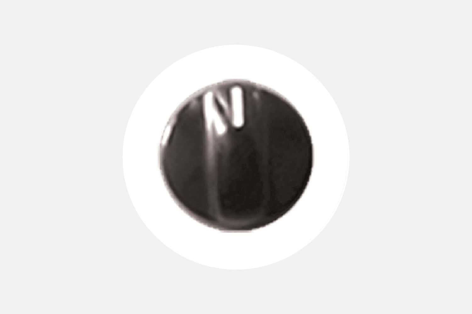Close-up of a black circular knob with a white vertical indicator line.